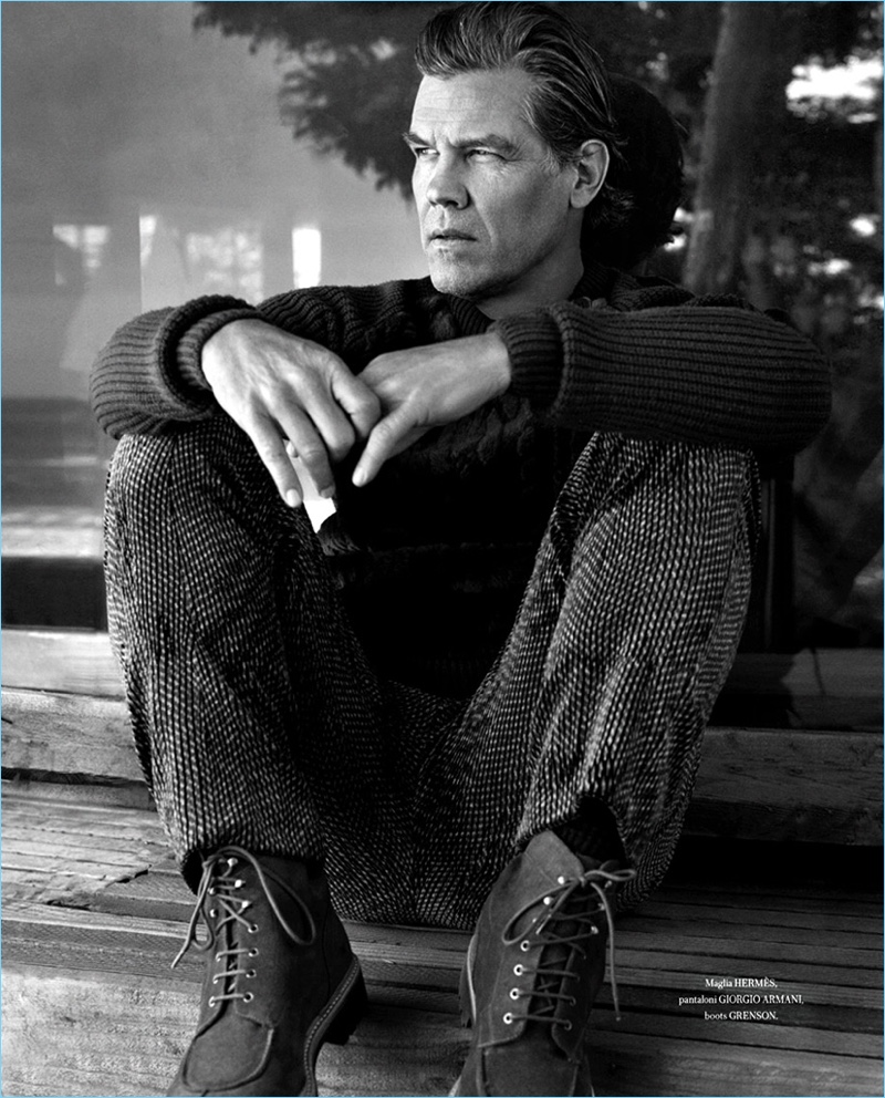 Appearing in a black and white image, Josh Brolin rocks a Hermès sweater with Giorgio Armani pants and Grenson boots.