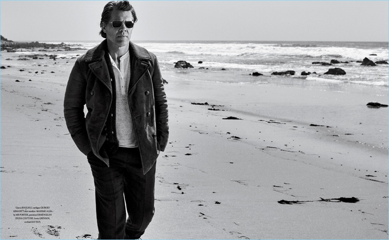 Taking to the beach, Josh Brolin wears a Boglioli jacket with a Giorgio Armani cardigan, and Massimo Alba t-shirt. His look is complete with Ermenegildo Zegna Couture pants and Ray-Ban sunglasses.