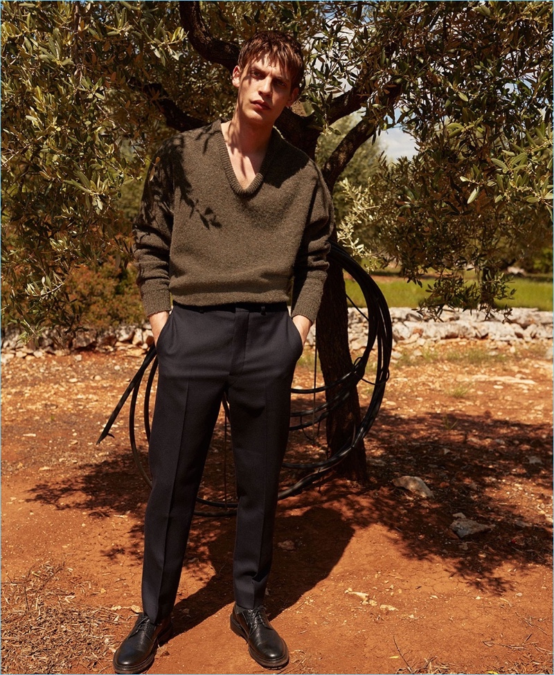 Showcasing smart style, Baptiste Radufe wears an oversize Lemaire sweater and trousers with Lanvin shoes.