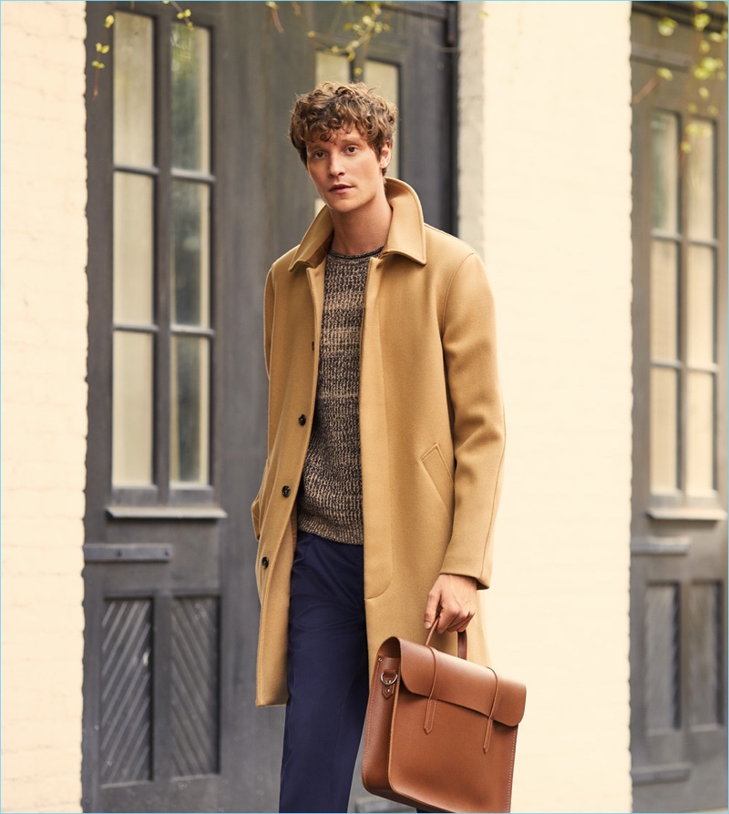 A.P.C. makes a classic camel statement with its Mac overcoat. East Dane complements the essential with a Tomorrowland sweater and trousers. Complete the look with a Cambridge Satchel folio.