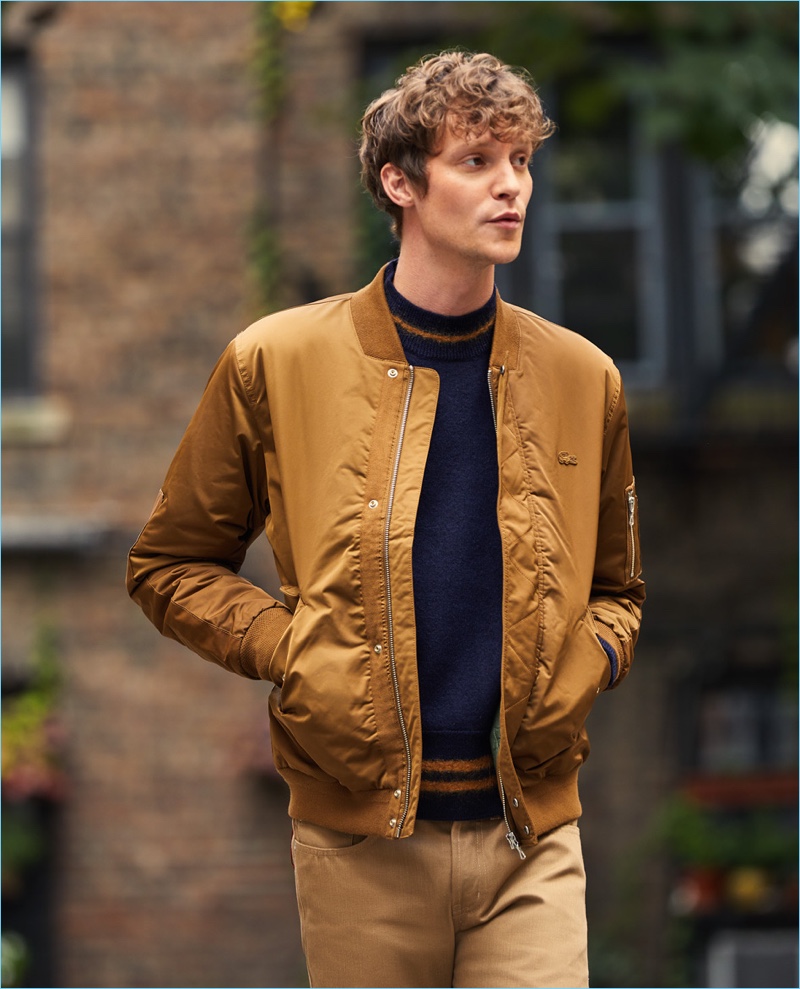 Camel gets sporty with this Lacoste padded bomber jacket. Reuniting with East Dane, Matthew Hitt wears the must-have with a Marni sweater and Naked & Famous jeans.