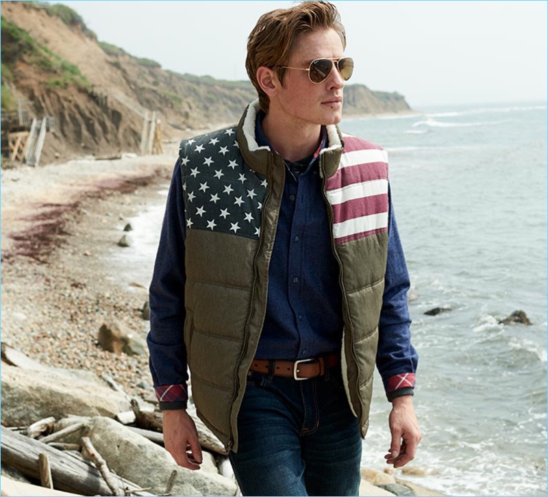 Connecting with Macy's, Patrick O'Donnell wears a flag quilted vest with Ray-Ban sunglasses.