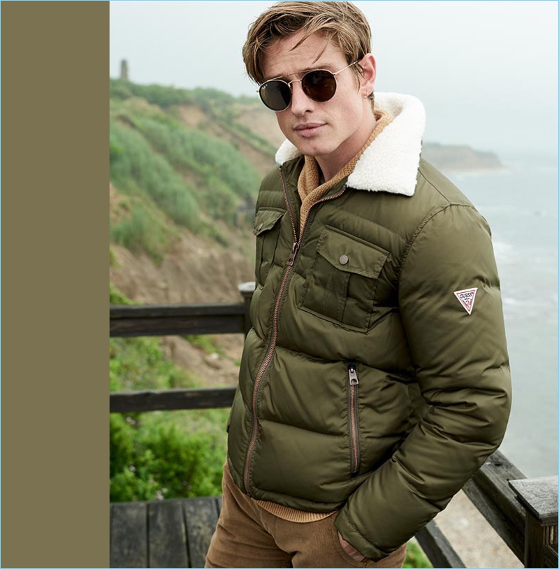 Tapping into military style, Patrick O'Donnell wears a GUESS quilted jacket with a fleece collar.