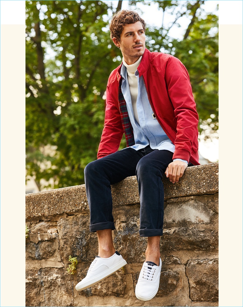 Switch Courses: East Dane makes a case for Baracuta's red G9 Harrington jacket. Pictured, David also sports a Patrik Ervell turtleneck, AMI shirt, and Naked & Famous corduroy pants. David's look is complete with white Zespa sneakers.