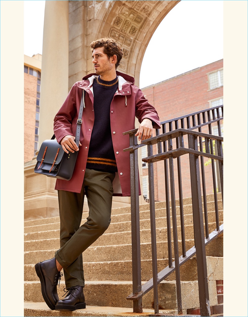 Fresh Neutrals: David Kitz steps out in a Stutterheim raincoat with a Cambridge satchel messenger and A.P.C. desert boots. He also sports a Marni mock neck sweater and cropped trousers.