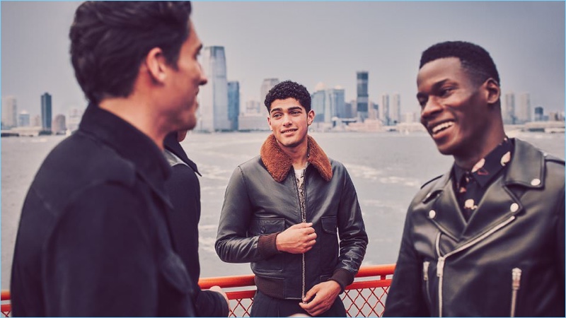 Left to Right: Ryan Kennedy wears a Connolly suede safari jacket. Torin Verdone rocks an AMI shearling-trimmed leather jacket and Beams Plus shirt with a Sunspel t-shirt. Meanwhile, David Agbodji wears a Saint Laurent leather biker jacket and flamingo print shirt.