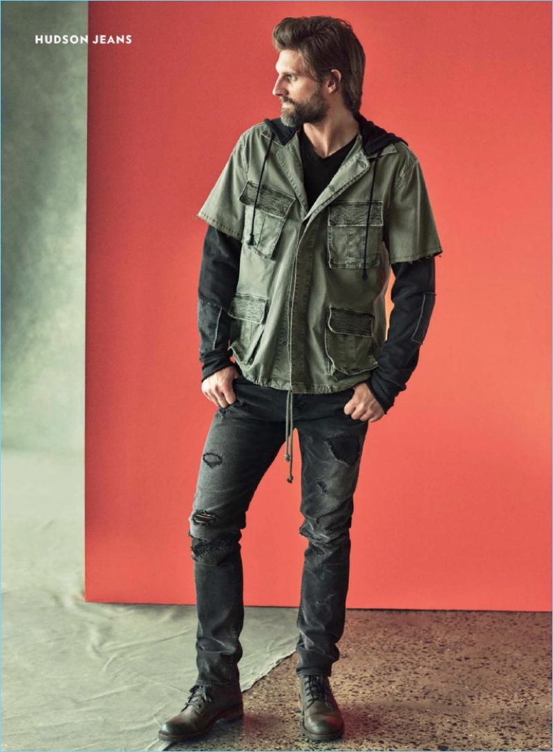 Taking to the photo studio, RJ Rogenski wears Hudson Jeans.