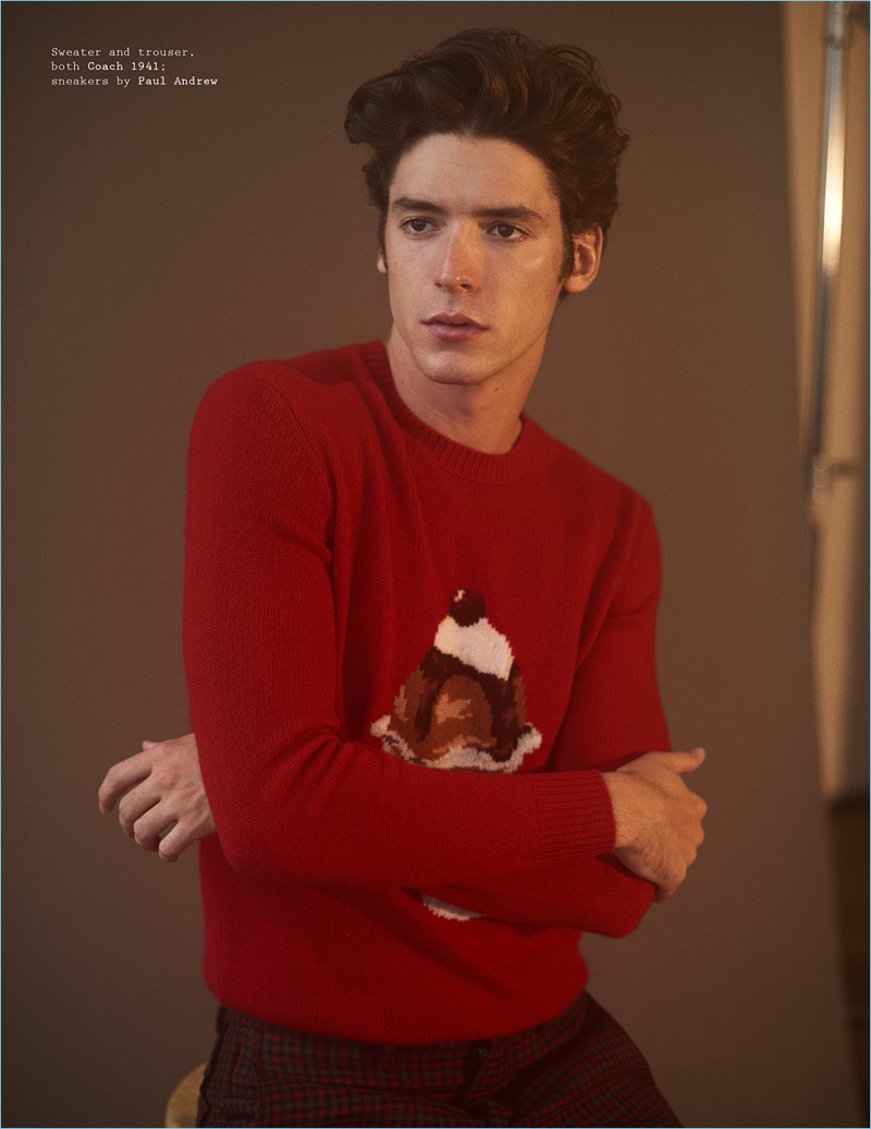 Standing out in red, Pico Alexander wears a Coach 1941 sweater and trousers.