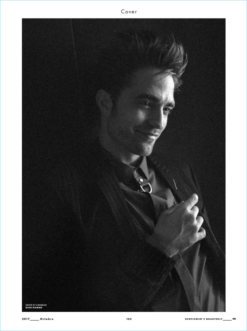 All smiles, Robert Pattinson sports a look by Dior Homme.