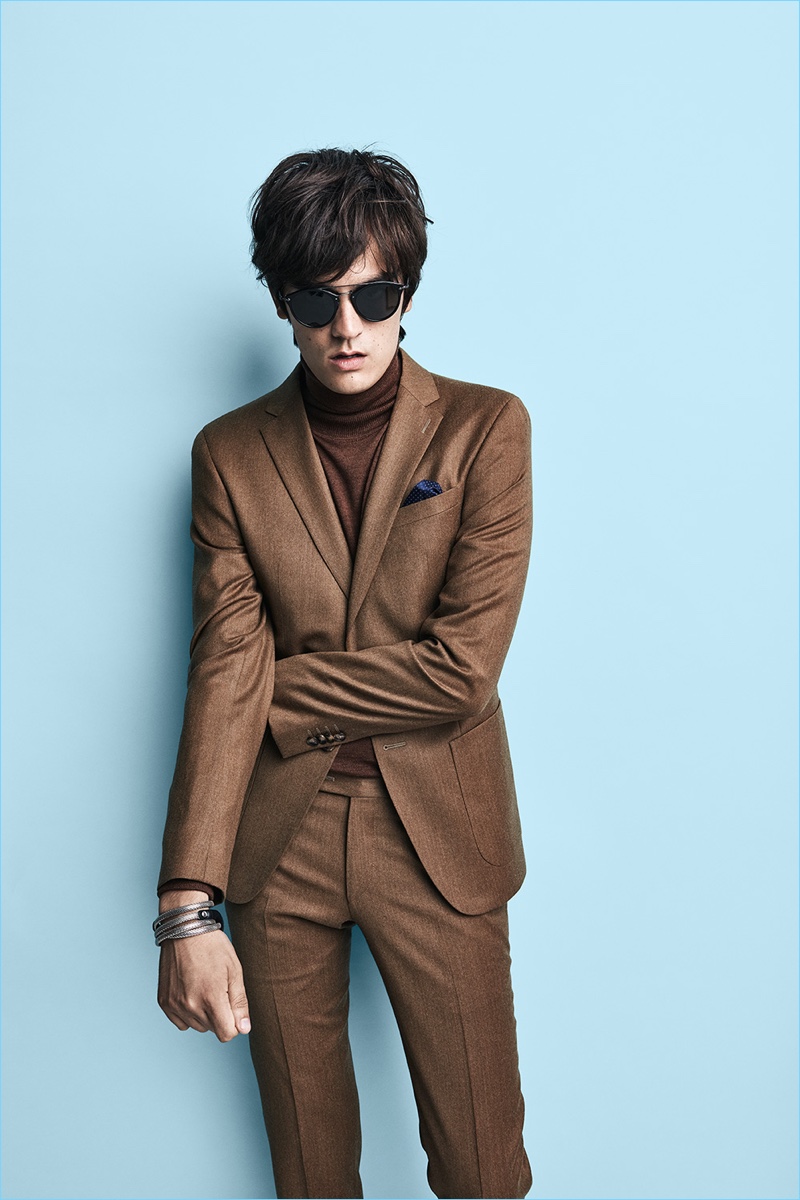 A fall vision, Alain-Fabien Delon wears a brown suit for SAND Copenhagen's campaign.