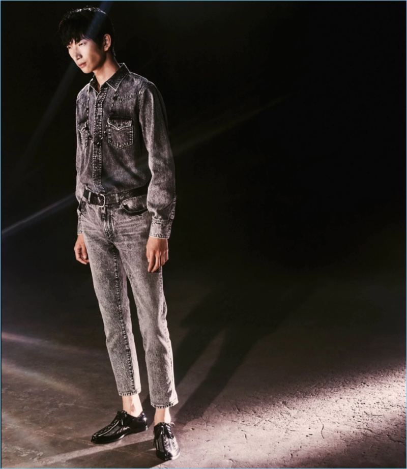 Double down on denim with Saint Laurent's denim western shirt and skinny jeans. Bom Lee wears the look with Saint Laurent patent leather bluchers.