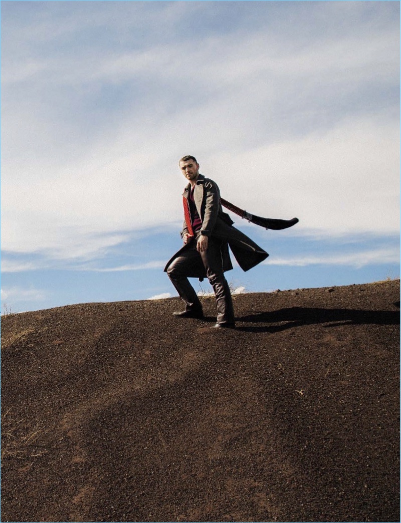 Taking to the outdoors, Sam Smith wears a Prada look with Saint Laurent boots.