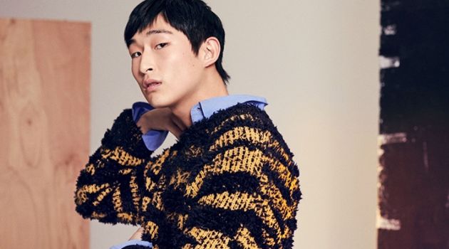 Interstella: Farfetch Makes a Stylish Case for Stella McCartney Making a texture play, Sang Woo Kim wears a Stella McCartney striped sweater and shirt.