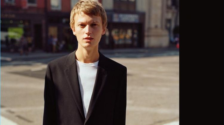 Taking to the streets of New York, Jonas Glöer wears a black Good Wool suit by Theory.