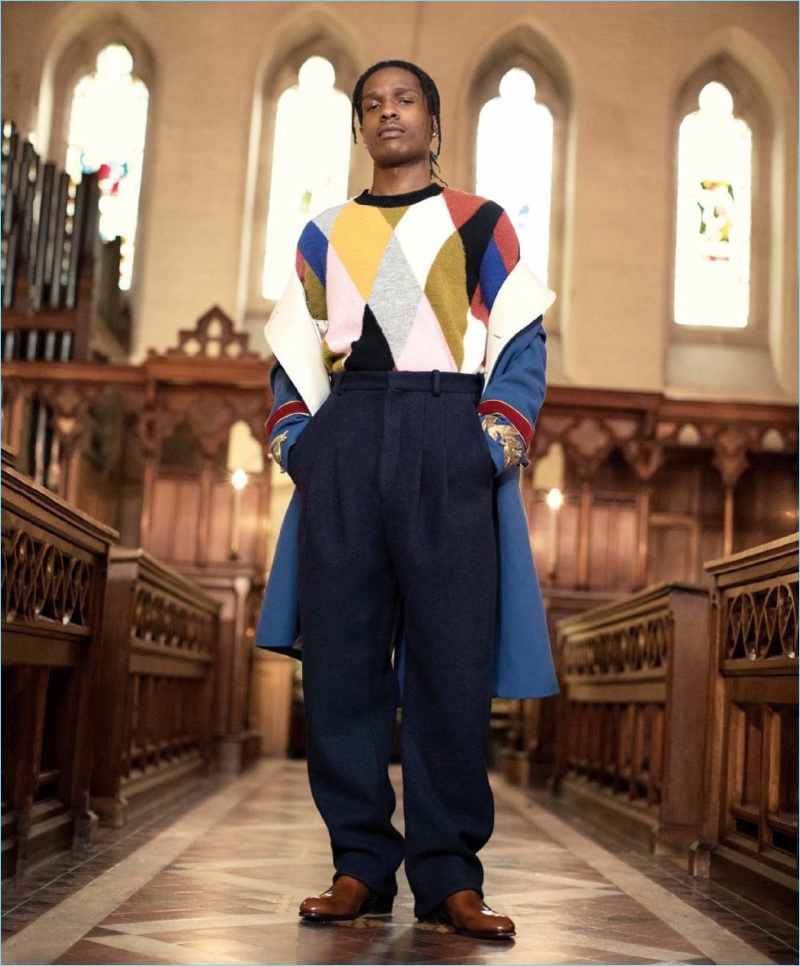 Making a colorful statement, A$AP Rocky wears a Kenzo sweater with a Gucci coat. The rapper also sports Acne Studios pants and Jimmy Choo boots.