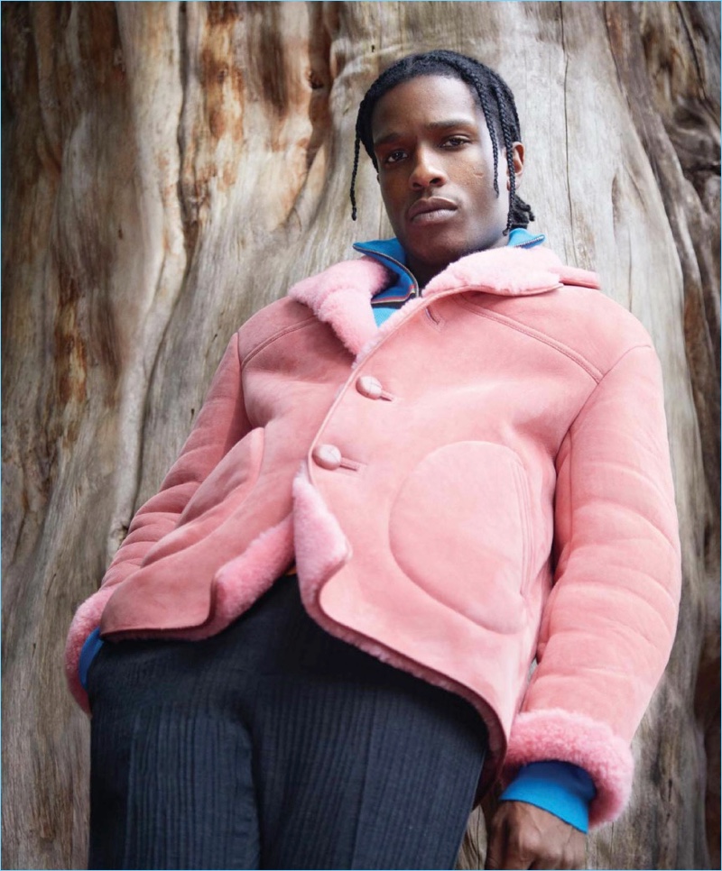 Rocking a pink Burberry jacket, A$AP Rocky also wears a J.W. Anderson sweater and Jil Sander pants.