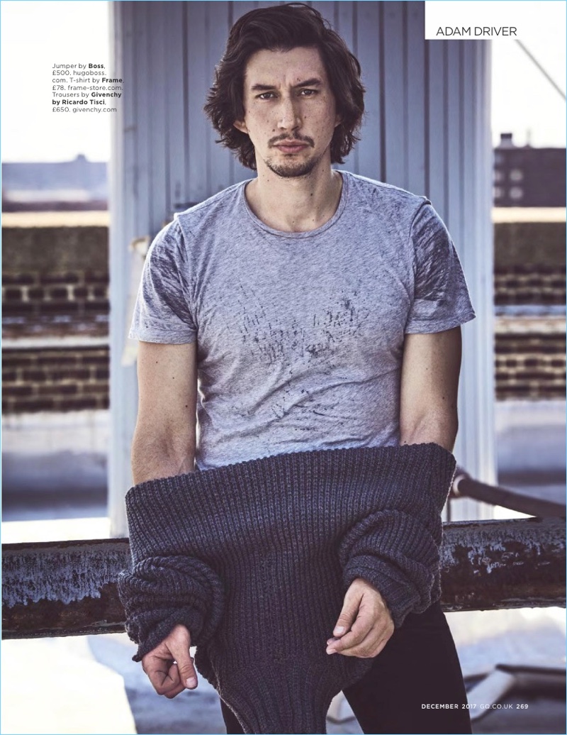 Star Wars actor Adam Driver sports a BOSS sweater with a Frame t-shirt and Givenchy pants.