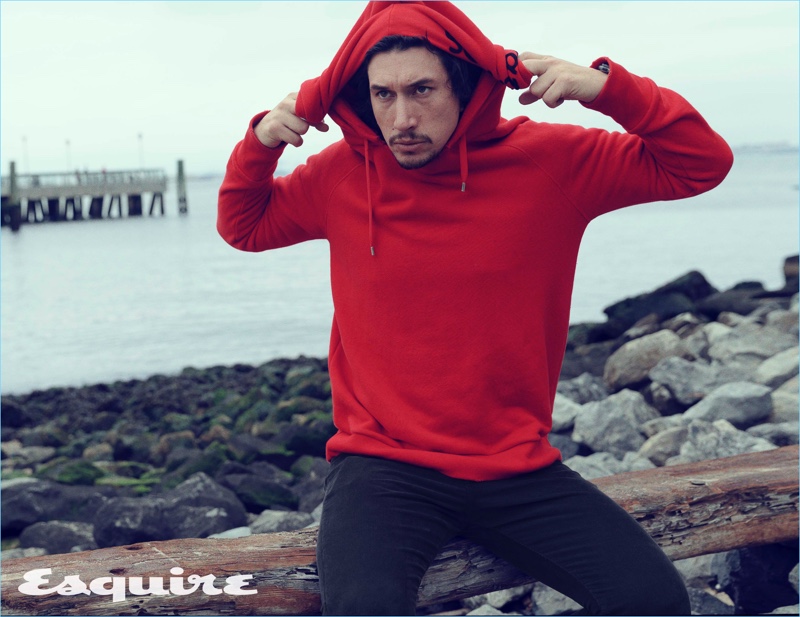 Actor Adam Driver wears a red hoodie and jeans by Gucci.