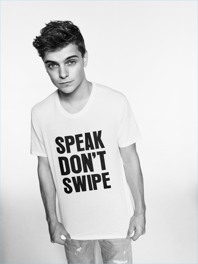 Martin Garrix rocks Armani Exchange's "Speak Don't Swipe" t-shirt.