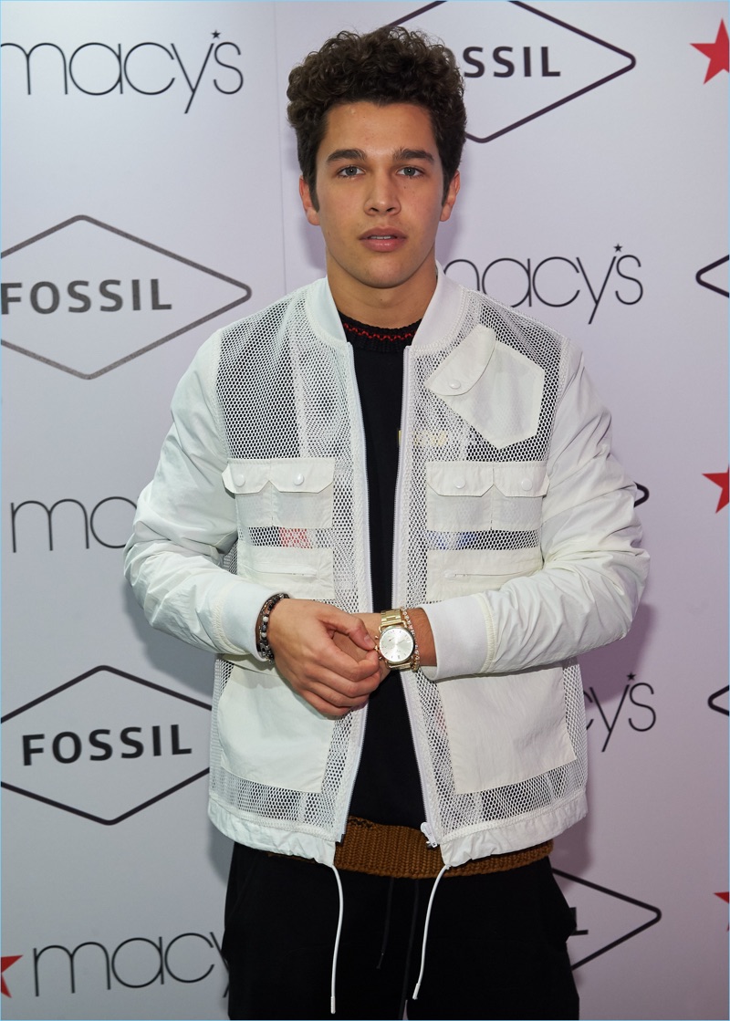Taking to the step and repeat, Austin Mahone poses for pictures at Macy's Herald Square.
