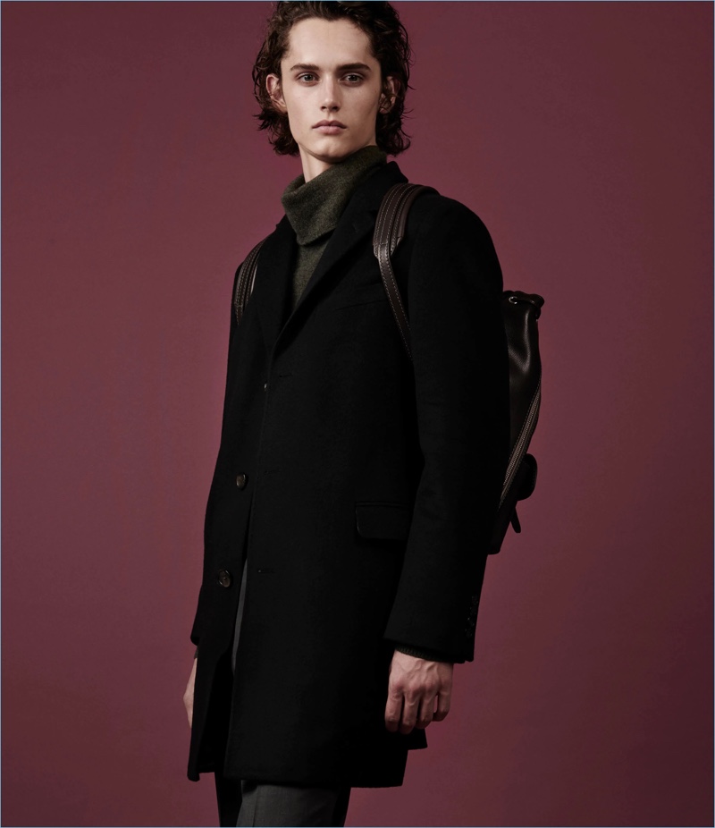 Prepared for cold weather, Barneys New York showcases an overcoat with a mélange cashmere turtleneck and trousers. The retailer also puts the spotlight on a Fontana Milano 1915 leather backpack.