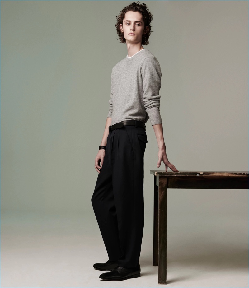 A grey Barneys New York sweater and leather bluchers complement Dries Van Noten wool trousers.