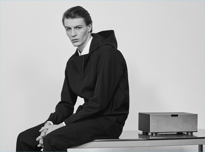 Going sporty, Finnlay Davis wears a hooded pullover and trousers by COS.