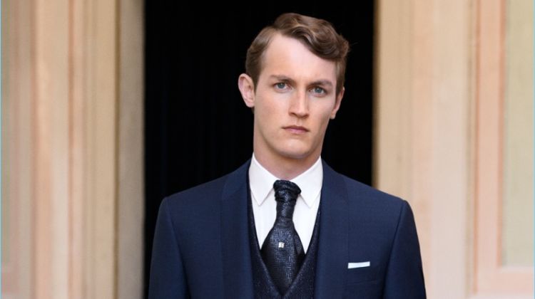 Model Rutger Schoone wears a sharp navy suit from Canali.