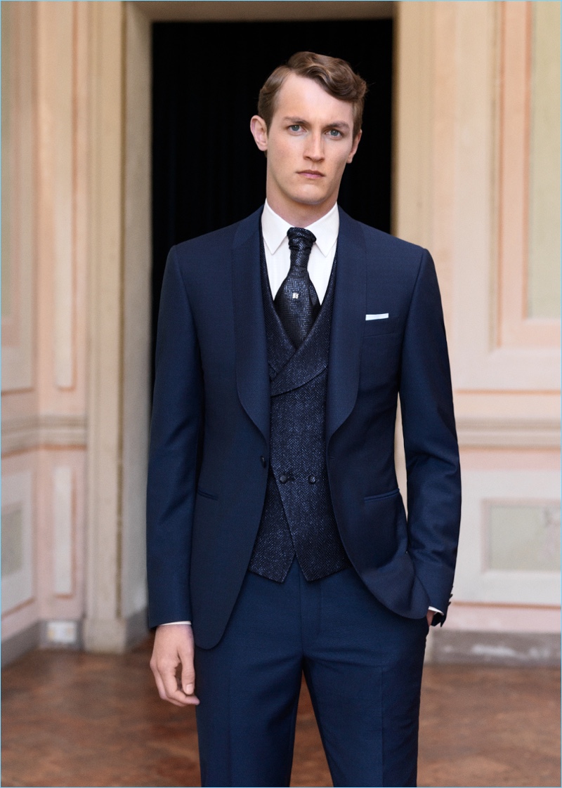 Model Rutger Schoone wears a sharp navy suit from Canali.