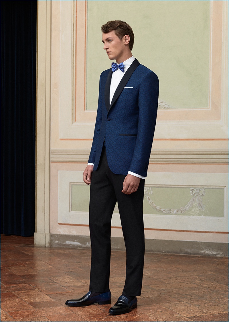 Dressed to the nines, Rutger Schoone wears a navy evening jacket and trousers by Canali.