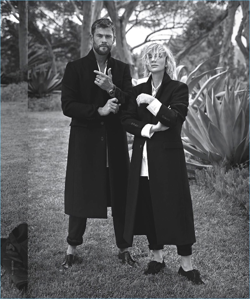 Embracing tailoring, Chris Hemsworth and Cate Blanchett pose for a picture. Hemsworth dons a Wardrobe NYC coat, Louis Vuitton shirt, and Giorgio Armani trousers.