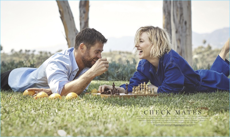 Laughing, Chris Hemsworth and Cate Blanchett play a game of chess. Hemsworth sports a Balenciaga shirt and Wardrobe NYC pants.