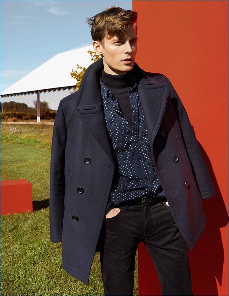 Club Monaco makes a case for navy and black style. Here, model Janis Ancens wears a peacoat with a turtleneck sweater. He also sports a polka dot print shirt and corduroy pants.