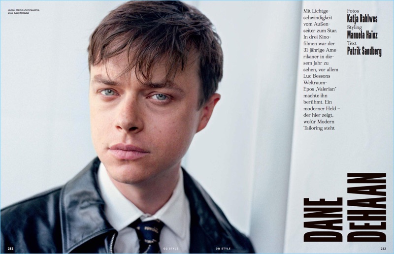 Dane DeHaan wears a leather trench and other fashions by Balenciaga.