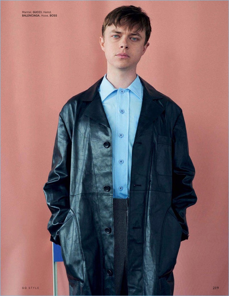 Sporting a leather Gucci coat, Dane DeHaan also wears a Balenciaga shirt and BOSS pants.