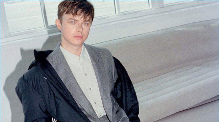 Connecting with GQ Style Germany, Dane DeHaan wears a Gosha Rubchinskiy x Adidas parka. He also sports a BOSS suit with an Our Legacy shirt. Balenciaga sneakers round out DeHaan's look.