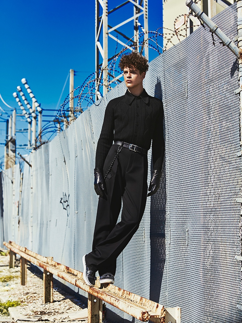 Sidney wears top Prada, belt, pants, shoes, and gloves Dior Homme.