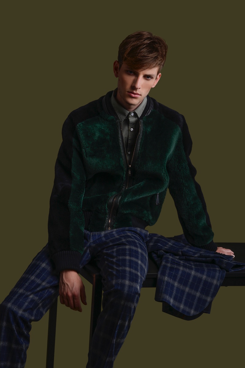 Thomas Barry wears green bomber jacket Philipp Plein and check suit Daks.