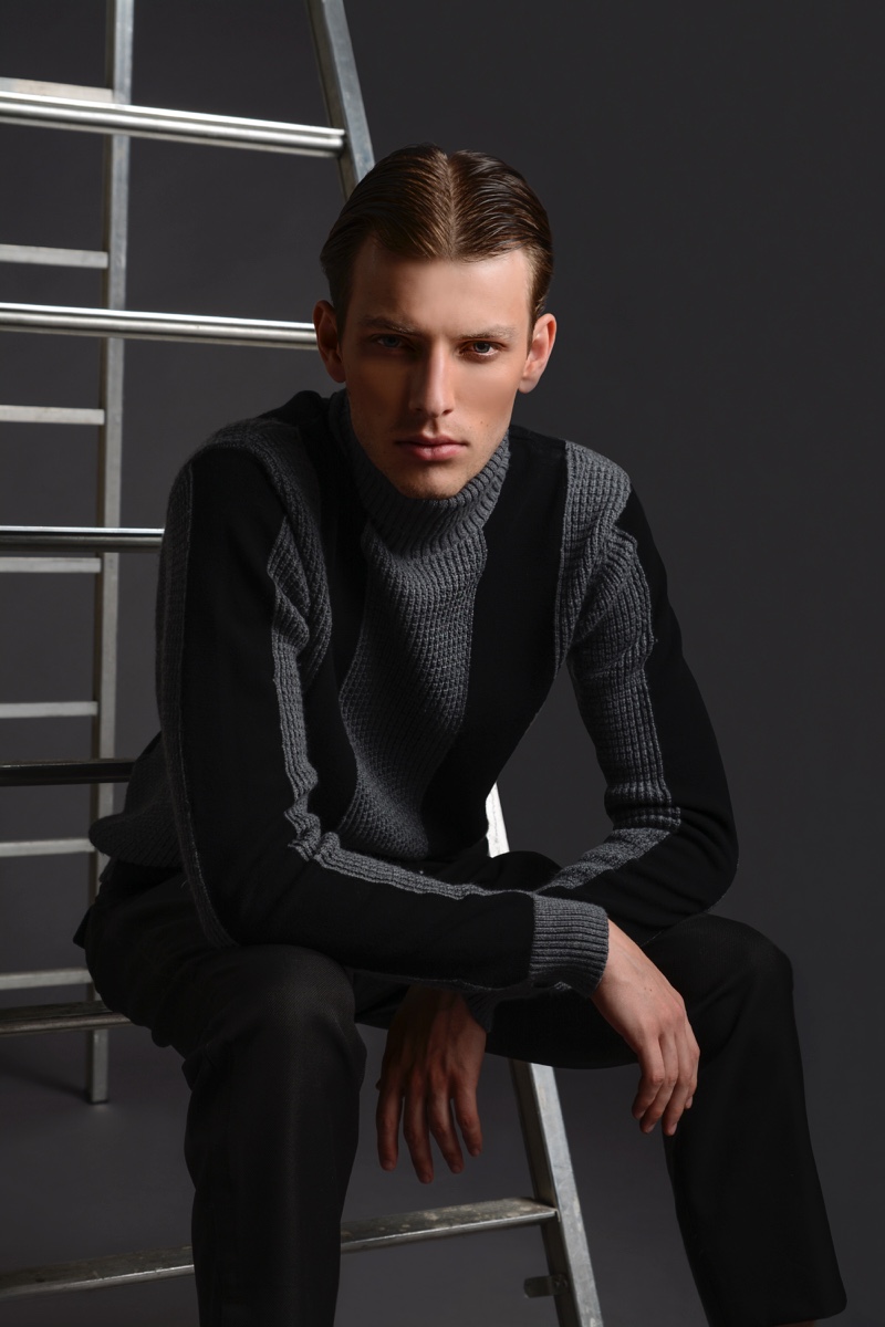 Thomas Barry wears sweater and pants Dirk Bikkembergs. 