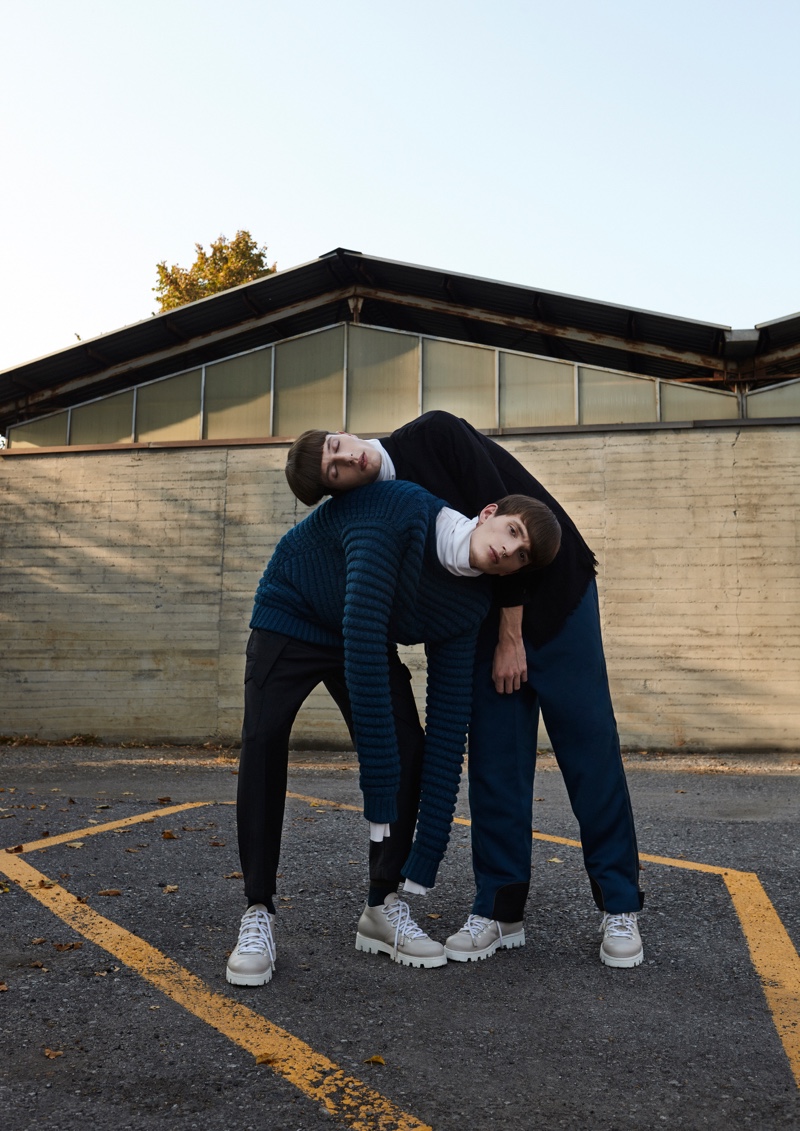 Left to Right: Gabriel Demaj wears an Ermenegildo Zegnaegildo Zegna turtleneck, sweater, and shoes with Christian Pellizari trousers. Andre Fernandes sports an Ermenegildo Zegna look with a Federico Curradi shirt.