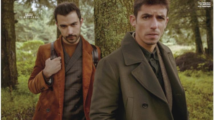 Diego Alfaro wears a H&M coat and sweater with a Montblanc backpack. He also sports a Welton & Sons suit. Alberto Guerra dons a Bottega Veneta shirt with a Welton & Sons suit, and Original Penguin coat.