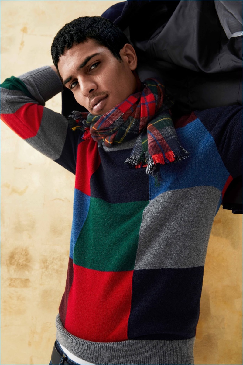 Making a graphic statement, Geron McKinley wears a Gap check sweater and plaid scarf.