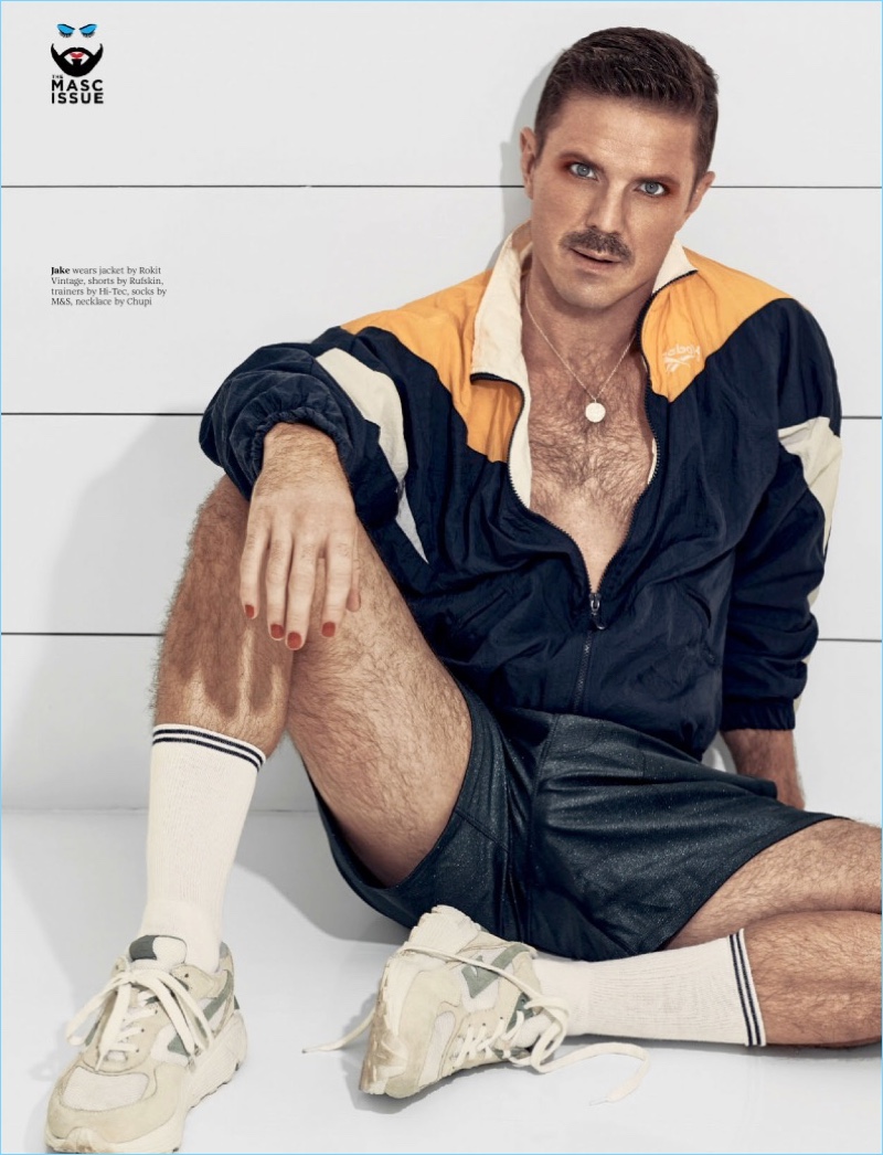 Jake Shears channels a retro attitude in a Rokit Vintage jacket with Rufskin shorts, and Hi-Tec sneakers.