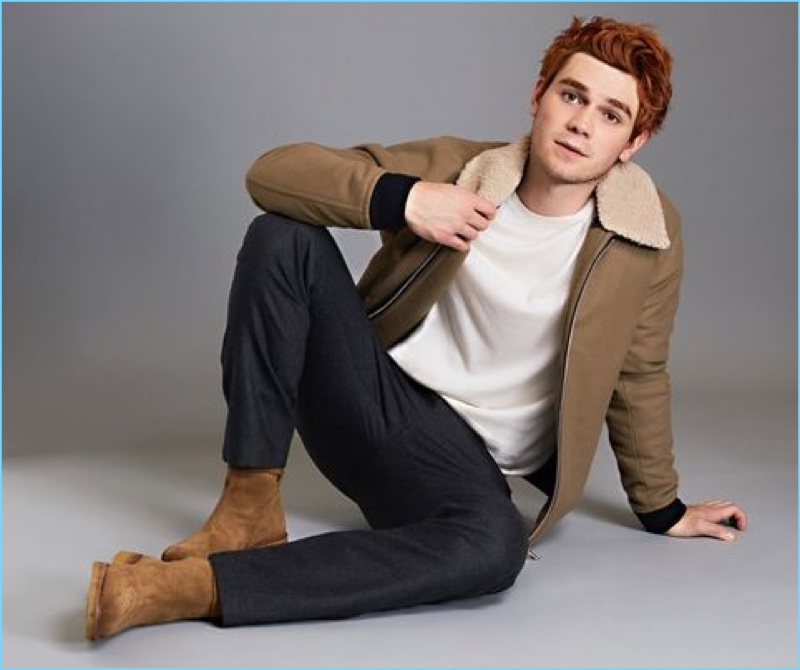 Riverdale star KJ Apa wears a Louis Vuitton sweater with a Theory bomber jacket and pants. The New Zealander also rocks AMI boots.