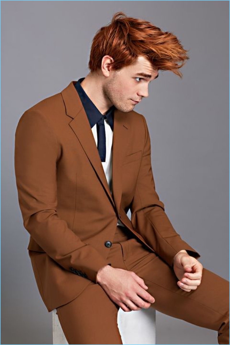 Connecting with Esquire, KJ Apa sports a Theory polo and suit.