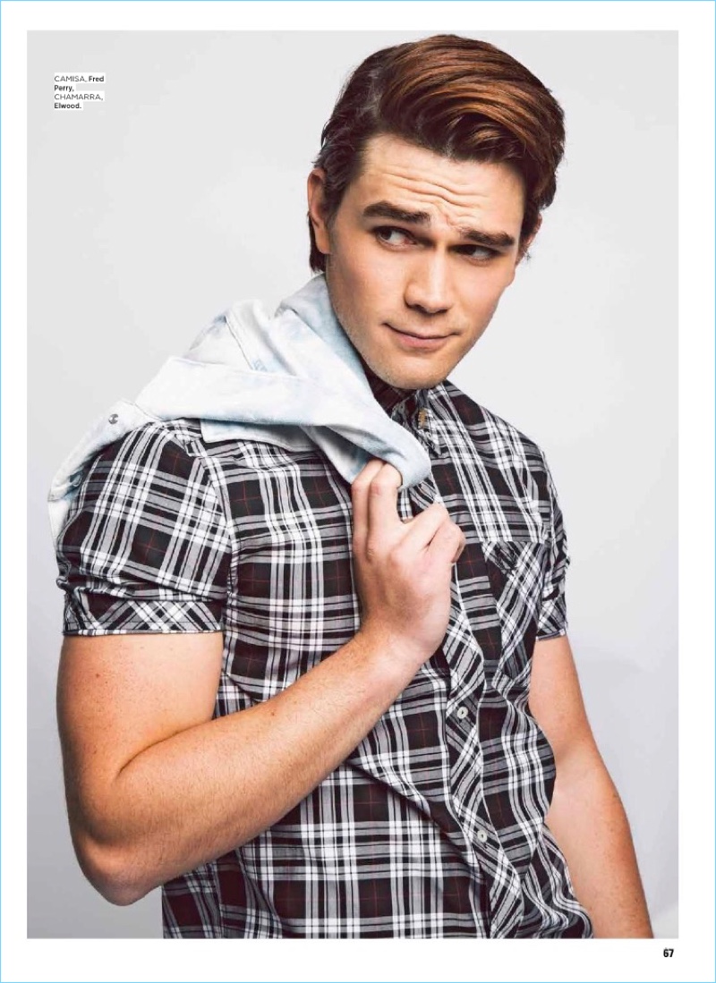 KJ Apa wears a Fred Perry short-sleeve shirt with an Elwood jacket.