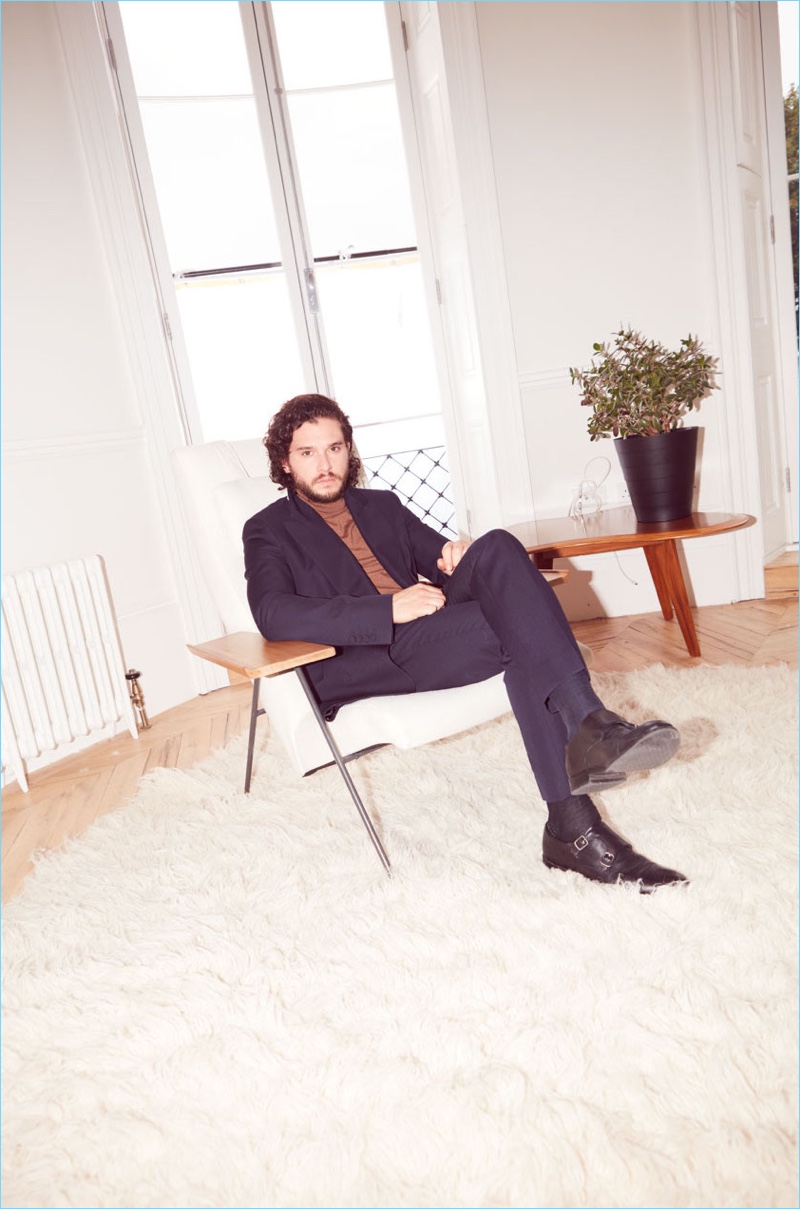 Connecting with The Guardian, Kit Harington wears a Dries Van Noten suit with an Acne Studios turtleneck and Gordon Rush shoes.