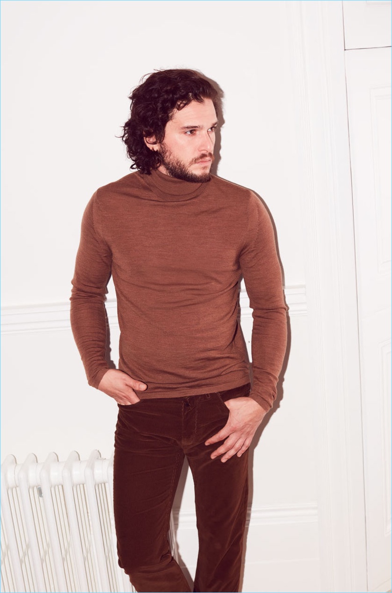 Actor Kit Harington sports a brown turtleneck by Acne Studios with Lanvin trousers.