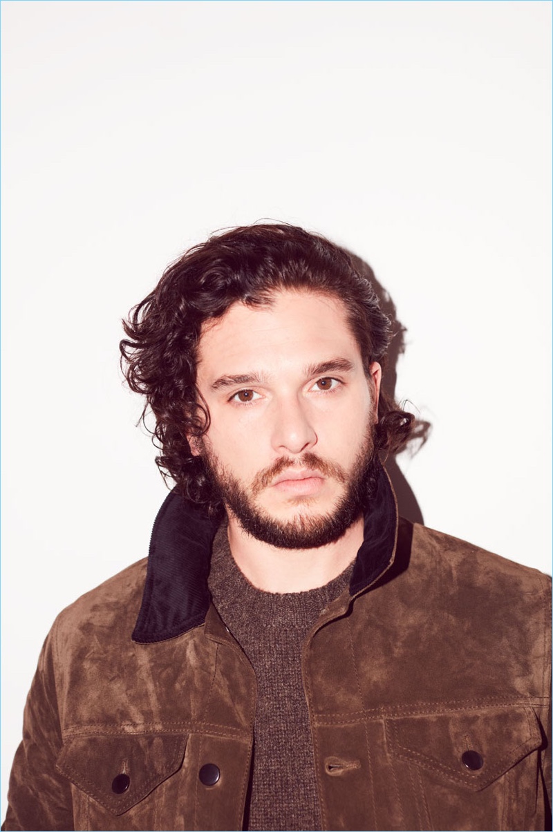 Kit Harington wears a jacket and sweater by Berluti.