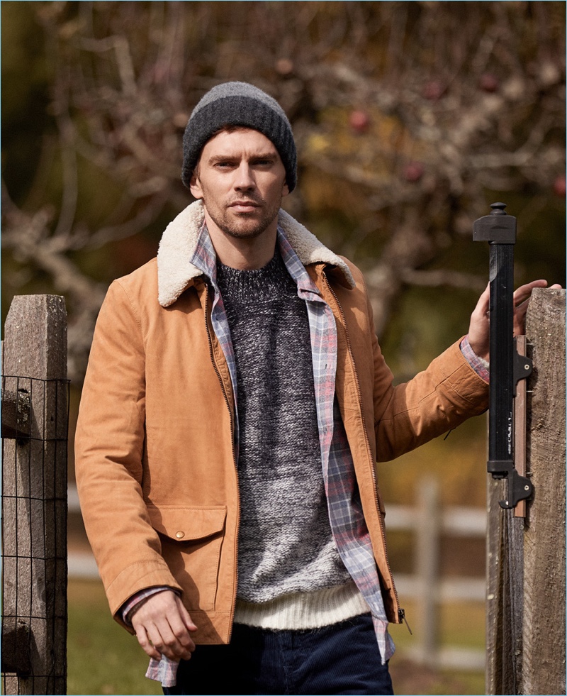 Embrace a rugged charm with your fall layering. A Scotch & Soda jacket and gradient sweater are standouts. Here, they're worn with a RVCA shirt, Norse Projects corduroy pants, and a Howlin' knit beanie.